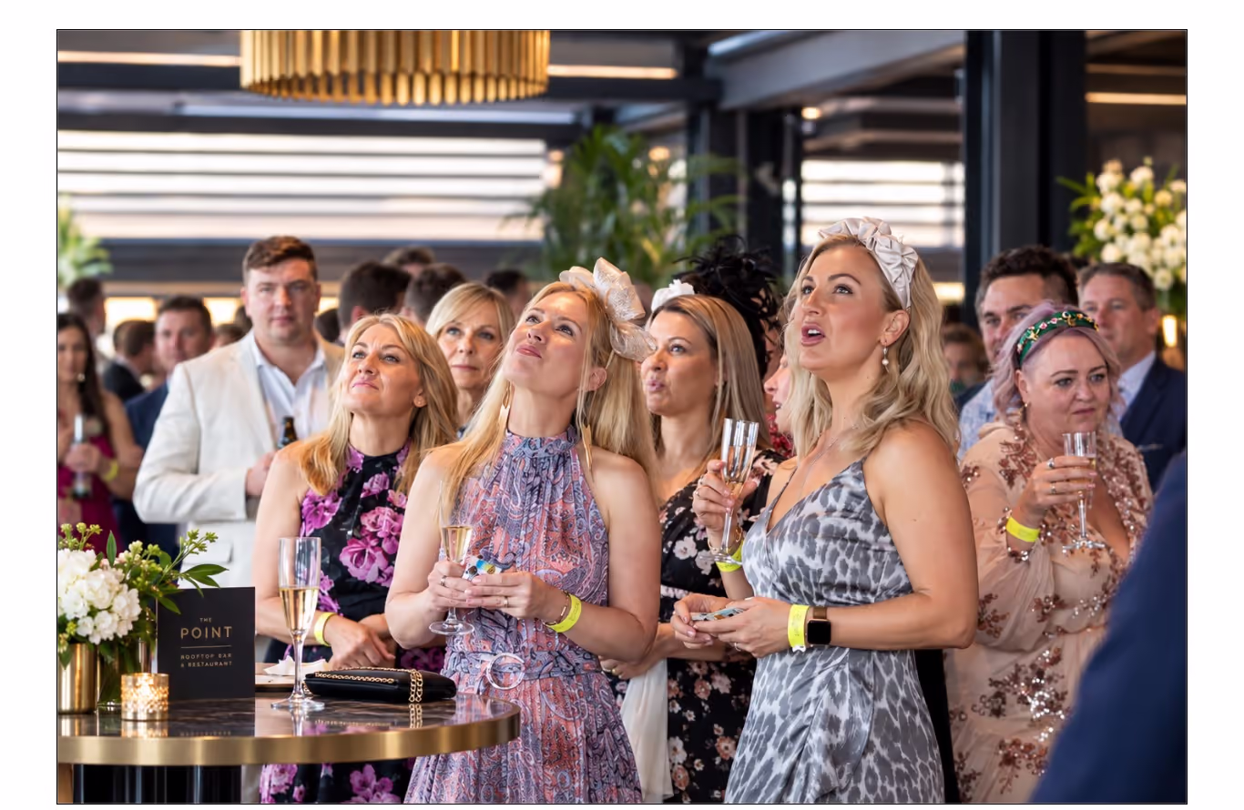 Guests celebrating Melbourne Cup Day with champagne at The Point Rooftop Bar & Restaurant, East Perth